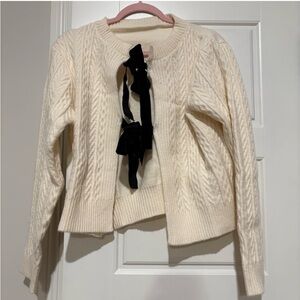 Cream cardigan with black velvet bows